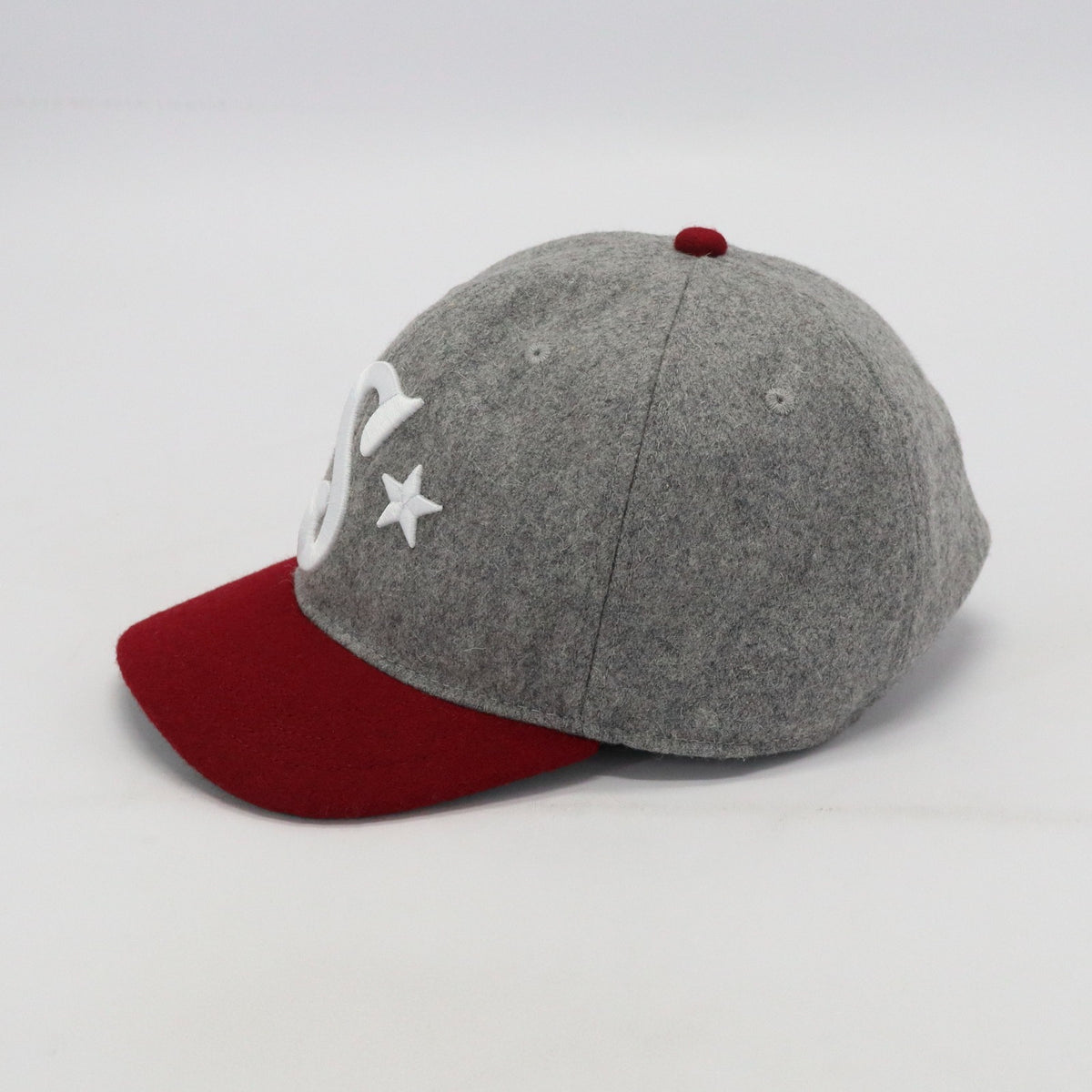 Southside Golf Co heritage wool golf hat side view in grey and burgundy with short brim design