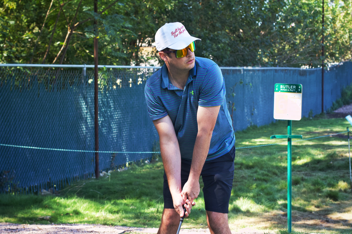 Golfer wearing Southside Golf Co golf hat during practice in Austin Texas