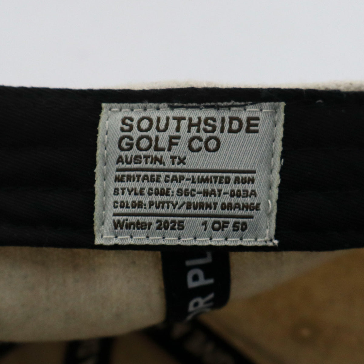 Limited release Southside Golf Co heritage golf hat tag showing style code and production number