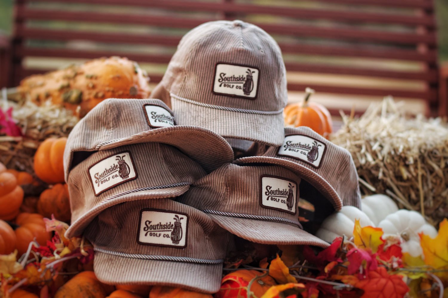 Southside Golf Co corduroy golf hats stacked in fall setting with embroidered patch logos, vintage style golf hats