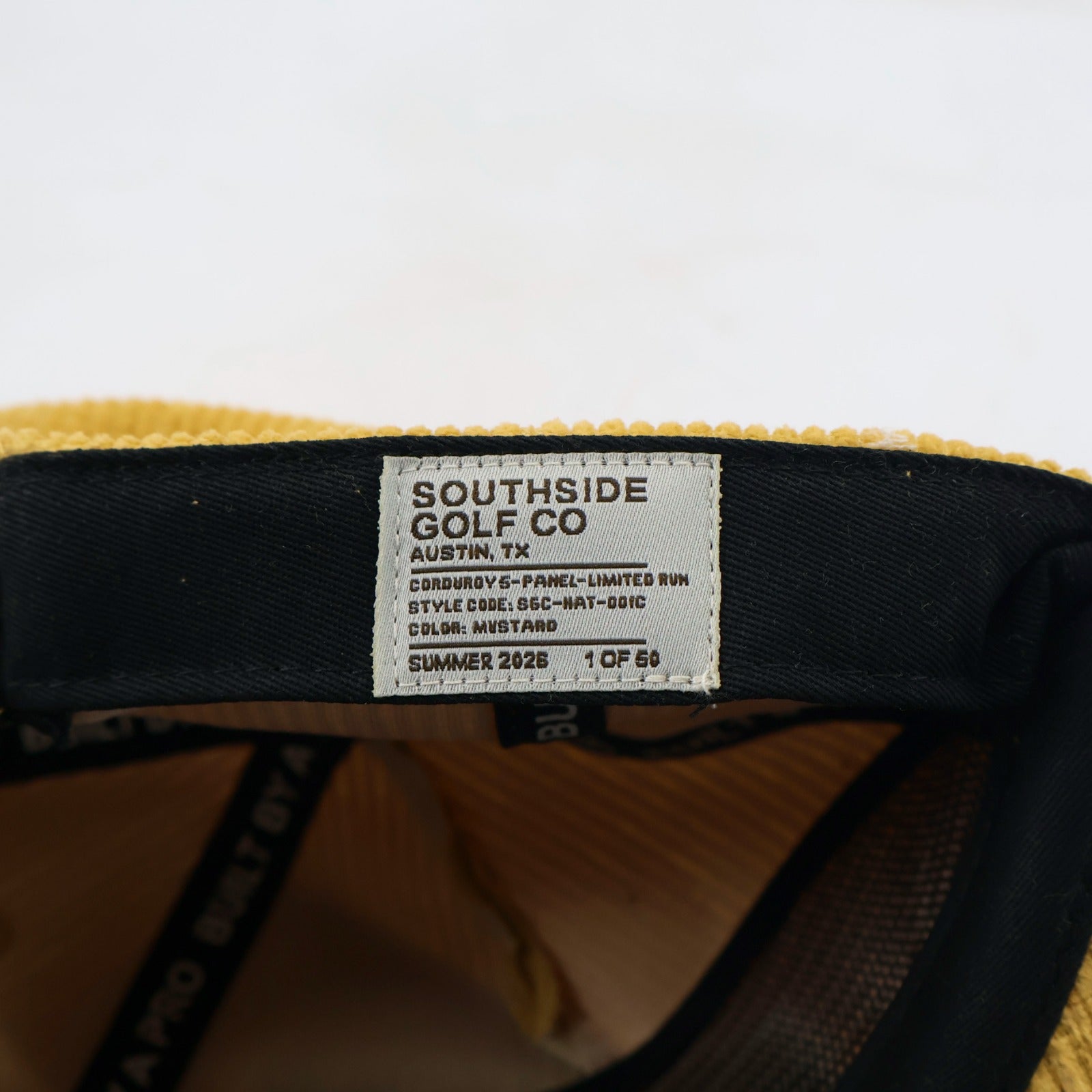 Golden Hour limited-run corduroy golf hat label marked Summer 2026 and 1 of 50