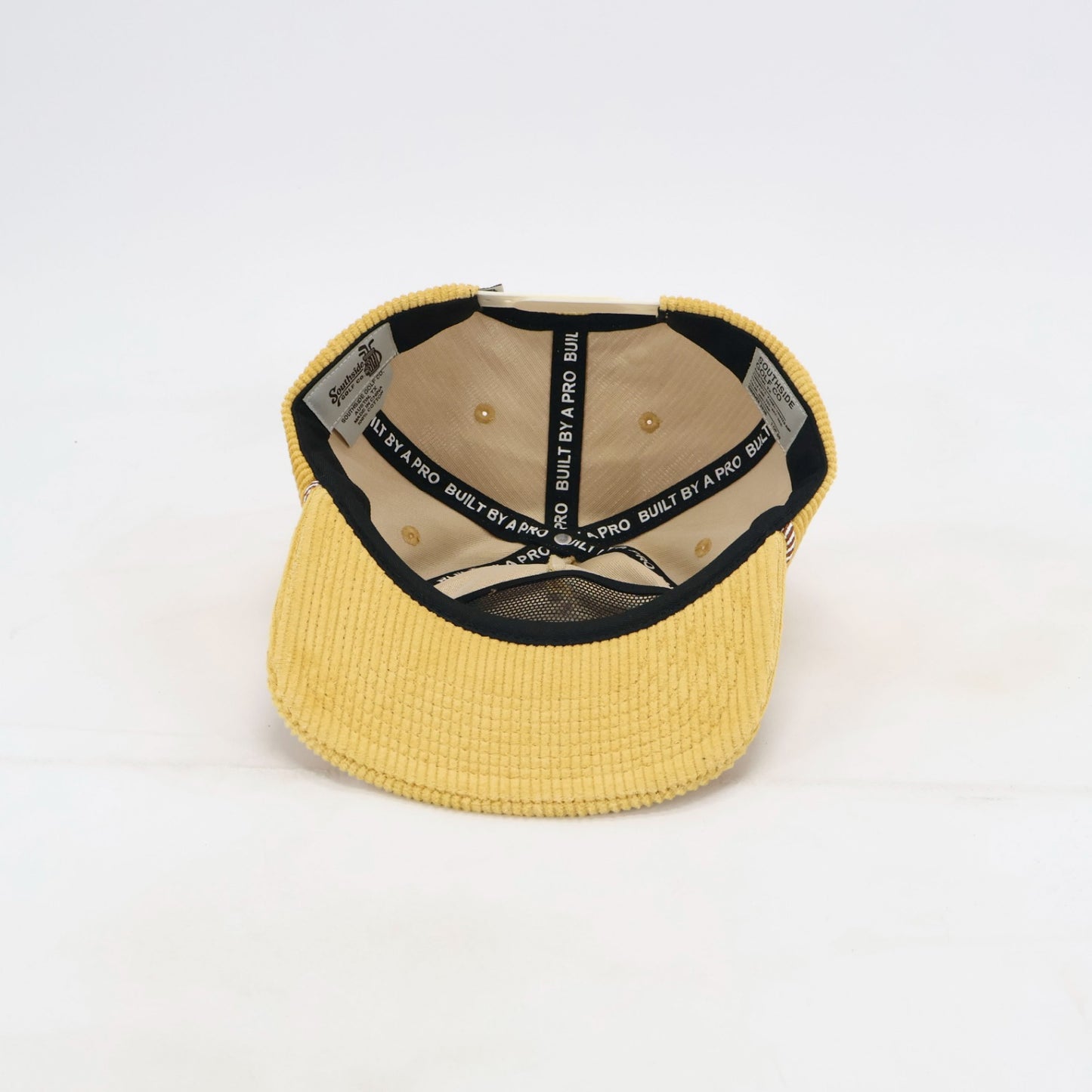 Interior of Southside Golden Hour corduroy golf hat with custom Built by a Pro taping