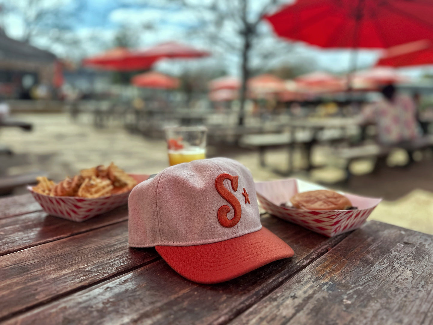 Southside Golf Co burnt orange and cream baseball hat with embroidered S logo and Austin star detail