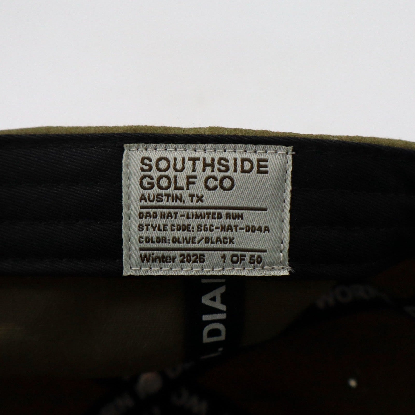 Southside Golf Co gray dad hat with embroidered circular logo patch, front view on white background.