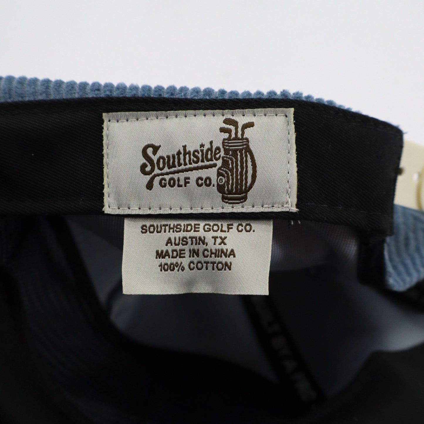 Close-up of Southside Golf Co. label on a cap with a blurred background