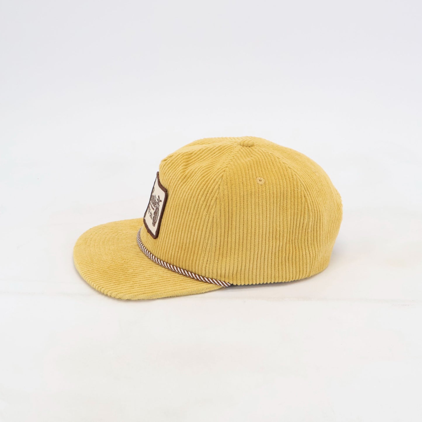 Side view of Golden Hour 5-panel corduroy golf hat in sunflower yellow