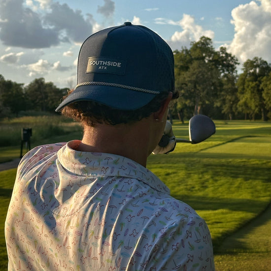 Golfer wearing the southside golf co performance hat while golfing at Onion Creek in Austin, Texas. 